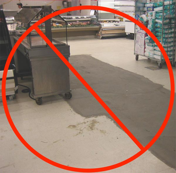 Fnsightly floor construction in a supermarket with a red NO symbol