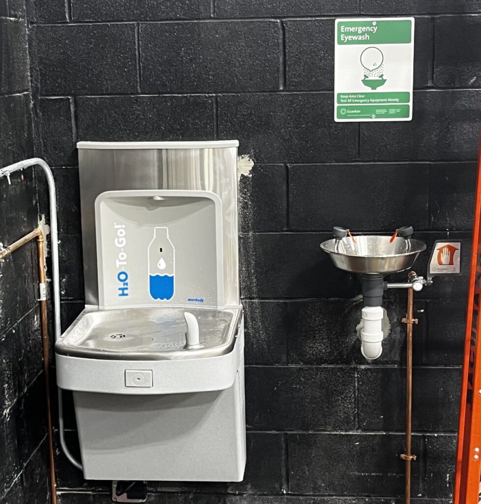 Murdock H2O-To-Go! Bottle Filler and water cooler installed beside an emergency eyewash station.